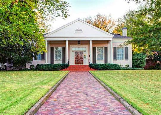 colonial house with brick pathway and columns